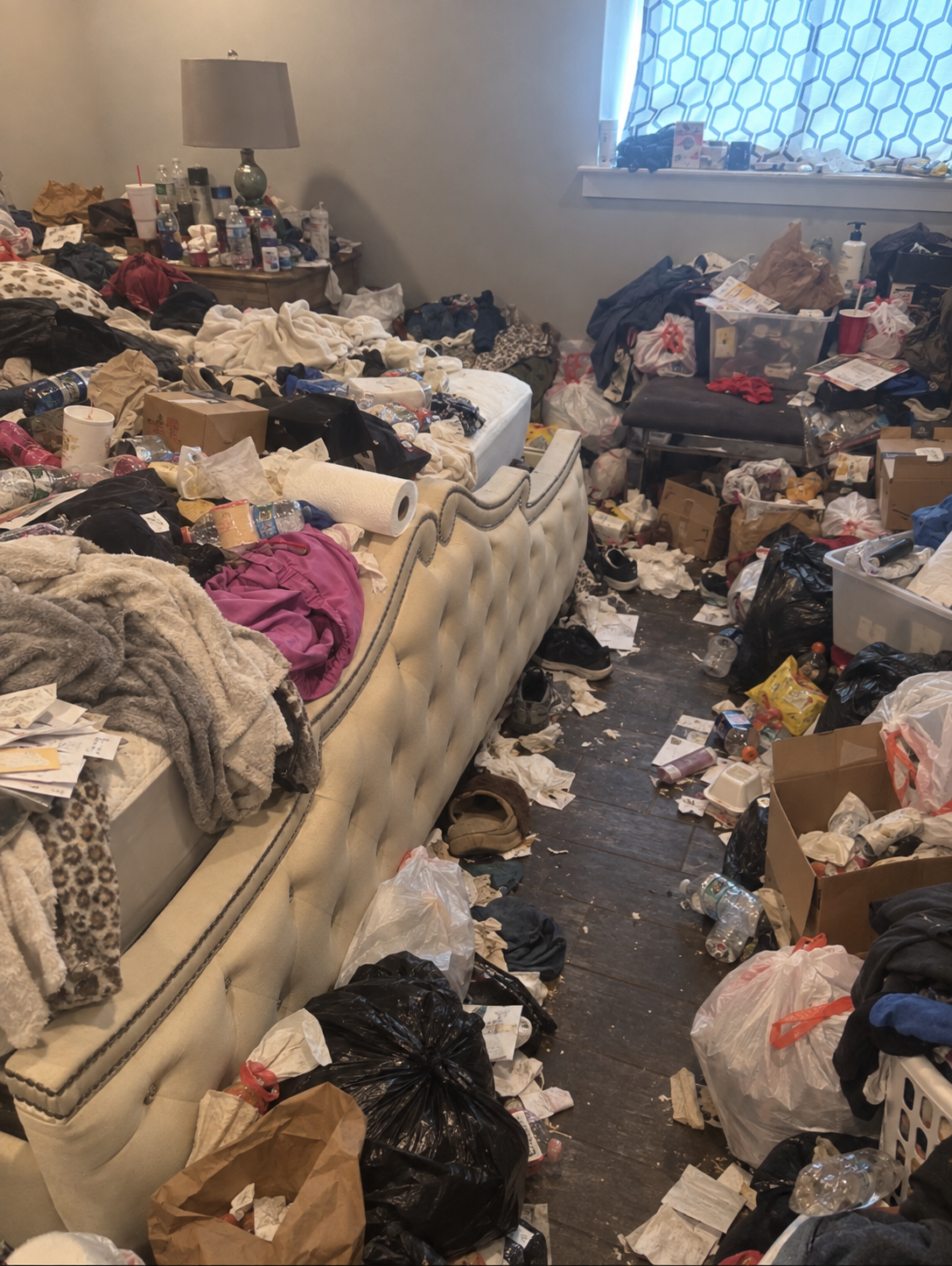 Primary bedroom before hoarding cleanup